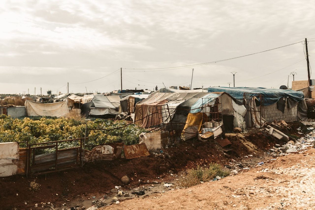 Temporary shelters on the landscape — a makeshift home for thousands of new arrivals.