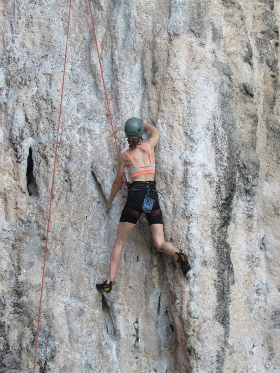 A climber tackling a vertical cliff face — the technical challenge of the Karakoram.