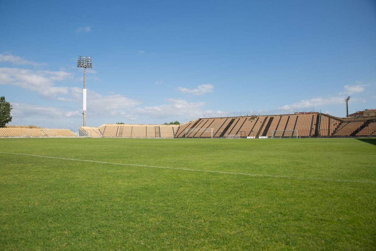 Empty stadium seats waiting for fans โ the asset FIFA tried to monetise.